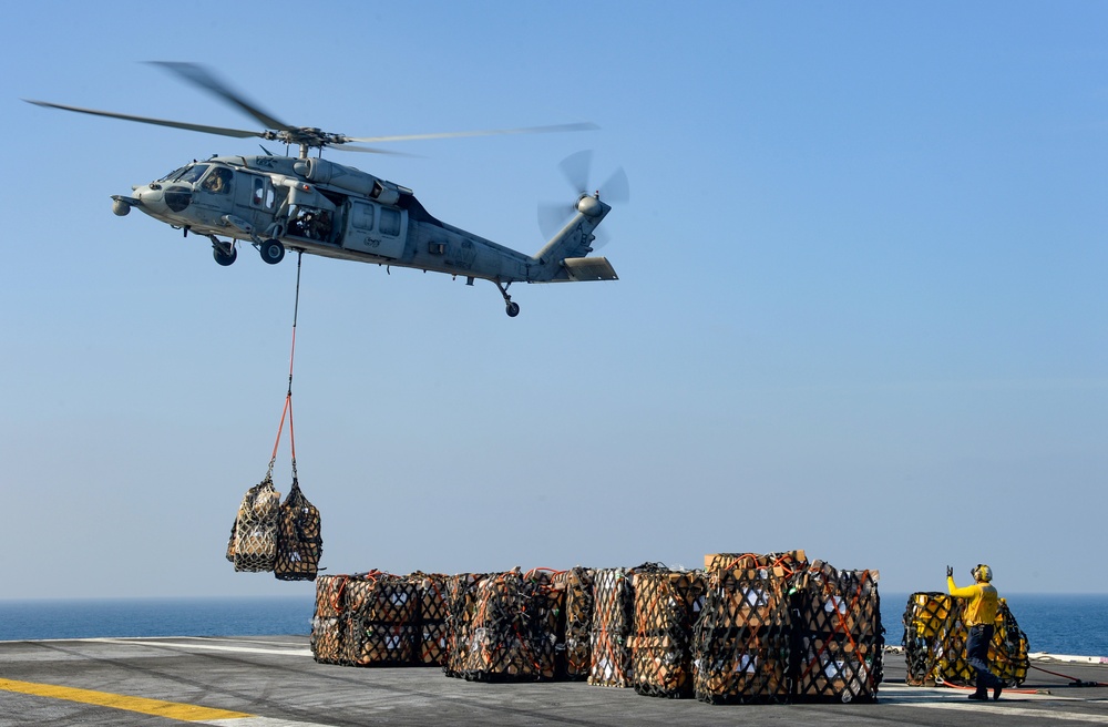 USS Harry S. Truman (CVN 75) conducts a replenishment-at-sea in the Arabian Sea