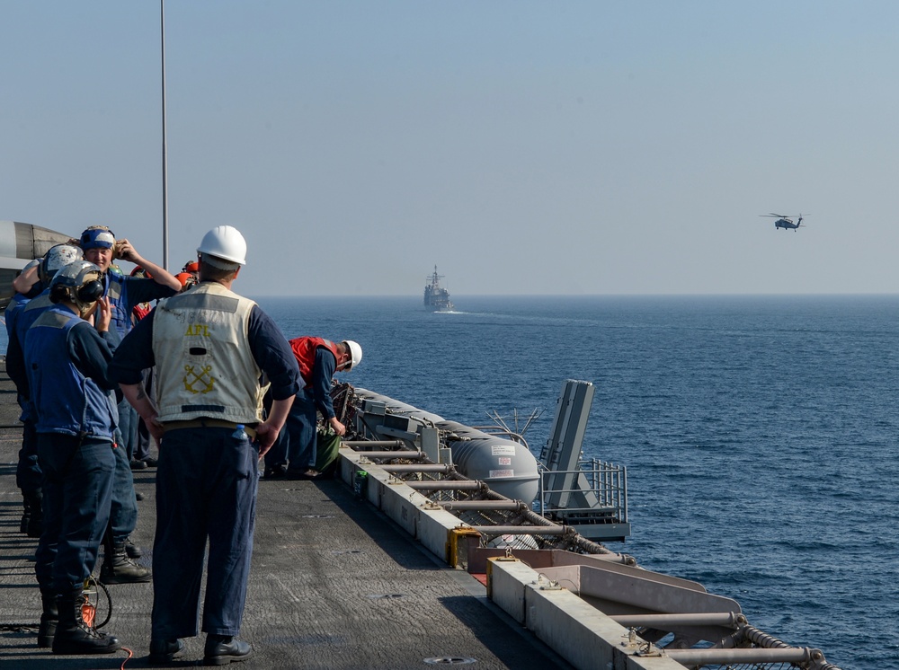 USS Harry S. Truman (CVN 75) conducts a replenishment-at-sea in the Arabian Sea