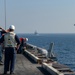 USS Harry S. Truman (CVN 75) conducts a replenishment-at-sea in the Arabian Sea