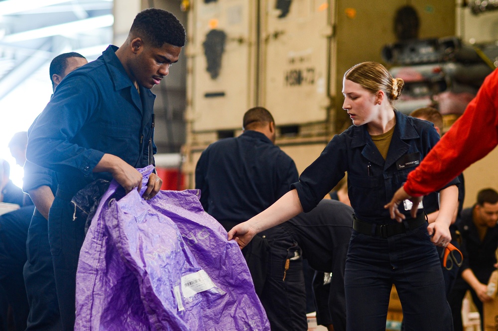 USS Harry S. Truman (CVN 75) conducts a replenishment-at-sea in the Arabian Sea