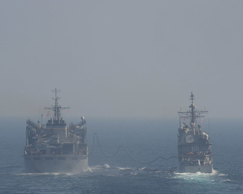 USS Harry S. Truman (CVN 75) conducts a replenishment-at-sea in the Arabian Sea