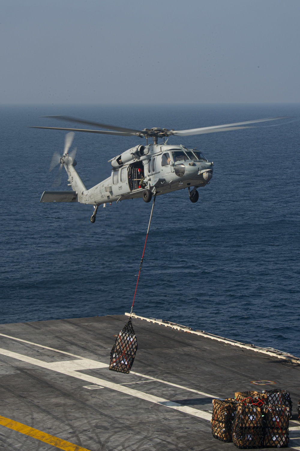 USS Harry S. Truman (CVN 75) conducts a replenishment-at-sea in the Arabian Sea