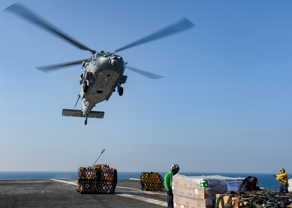 USS Harry S. Truman (CVN 75) conducts a replenishment-at-sea in the Arabian Sea