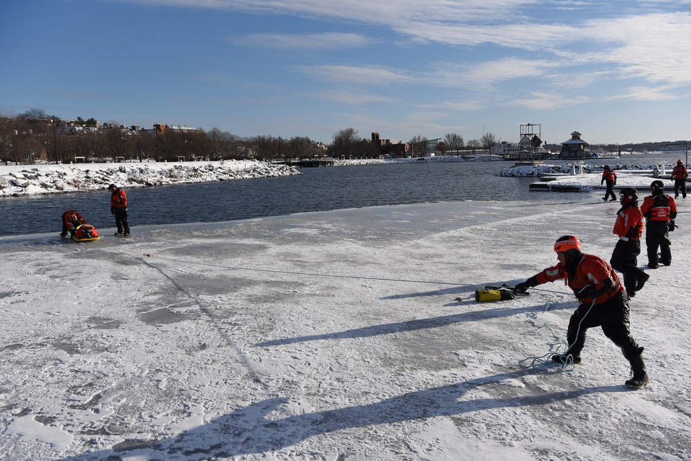 Coast Guard rescue crew members conduct ice rescue training