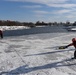 Coast Guard rescue crew members conduct ice rescue training