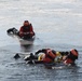 Coast Guard rescue crew members conduct ice rescue training