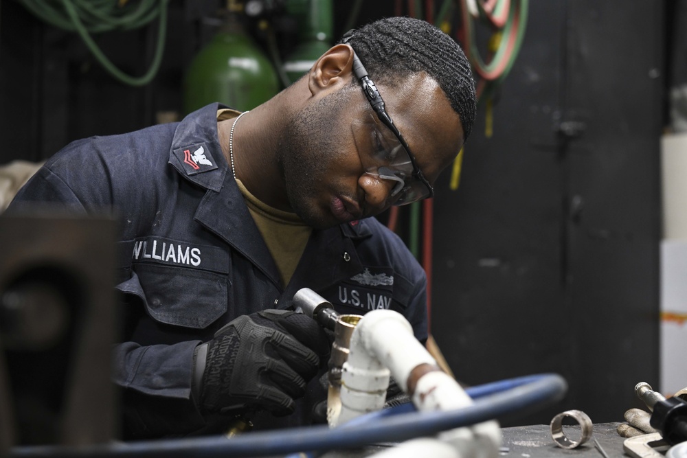 Blue Ridge sailor checks tools