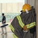 Civilian contractors clean fire truck bays