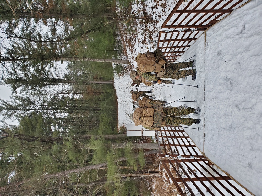 Fort McCoy Cold-Weather Operations Course students practice snowshoeing, ahkio sled use