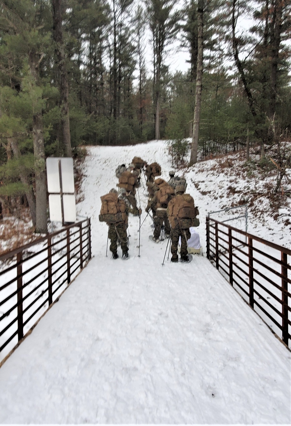 Fort McCoy Cold-Weather Operations Course students practice snowshoeing, ahkio sled use