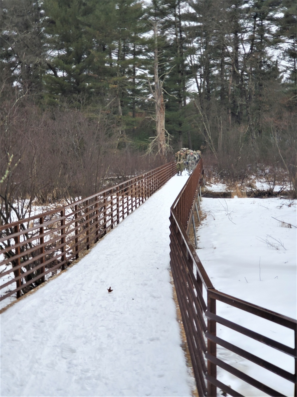 Fort McCoy Cold-Weather Operations Course students practice snowshoeing, ahkio sled use