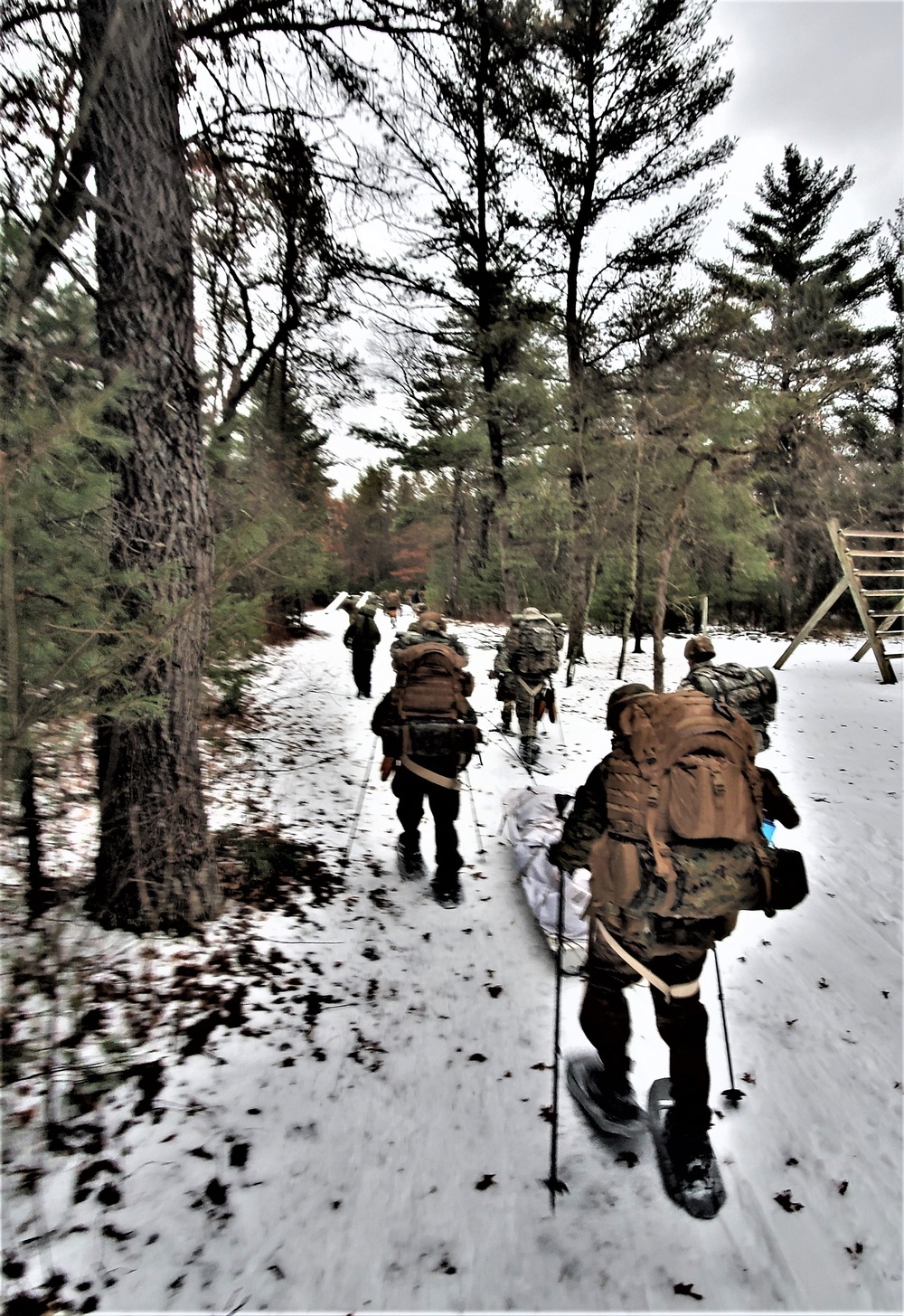 Fort McCoy Cold-Weather Operations Course students practice snowshoeing, ahkio sled use