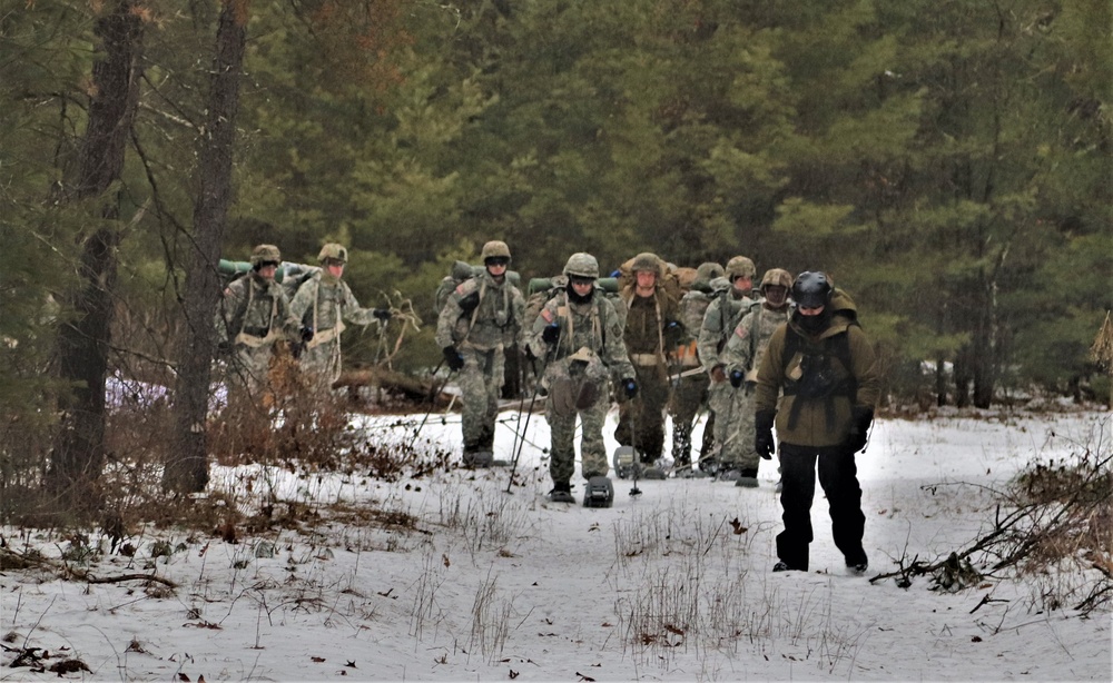 Fort McCoy Cold-Weather Operations Course students practice snowshoeing, ahkio sled use