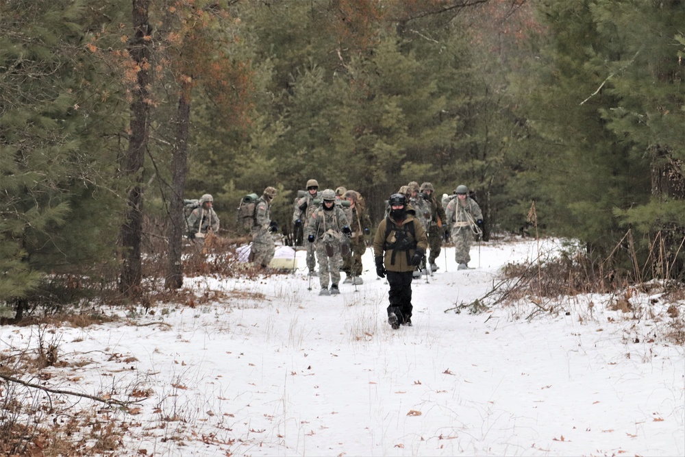Fort McCoy Cold-Weather Operations Course students practice snowshoeing, ahkio sled use