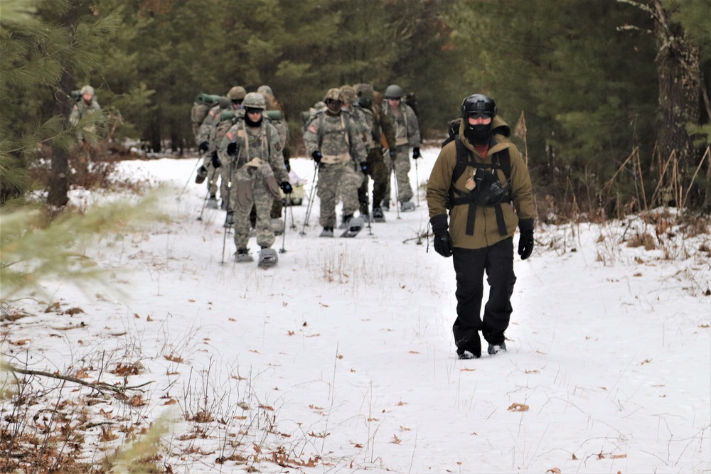 Fort McCoy Cold-Weather Operations Course students practice snowshoeing, ahkio sled use
