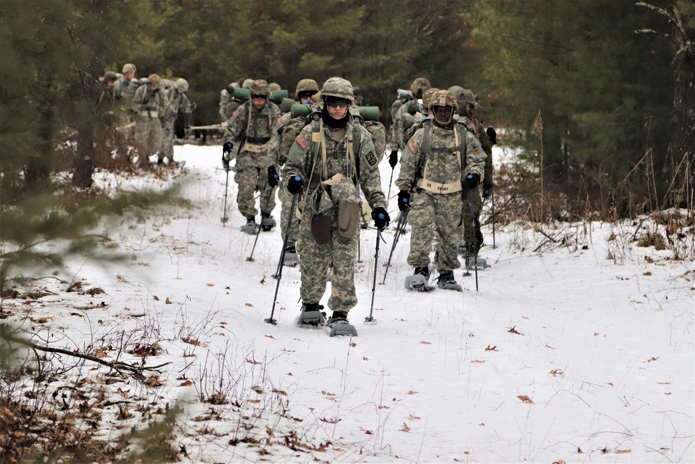 Fort McCoy Cold-Weather Operations Course students practice snowshoeing, ahkio sled use