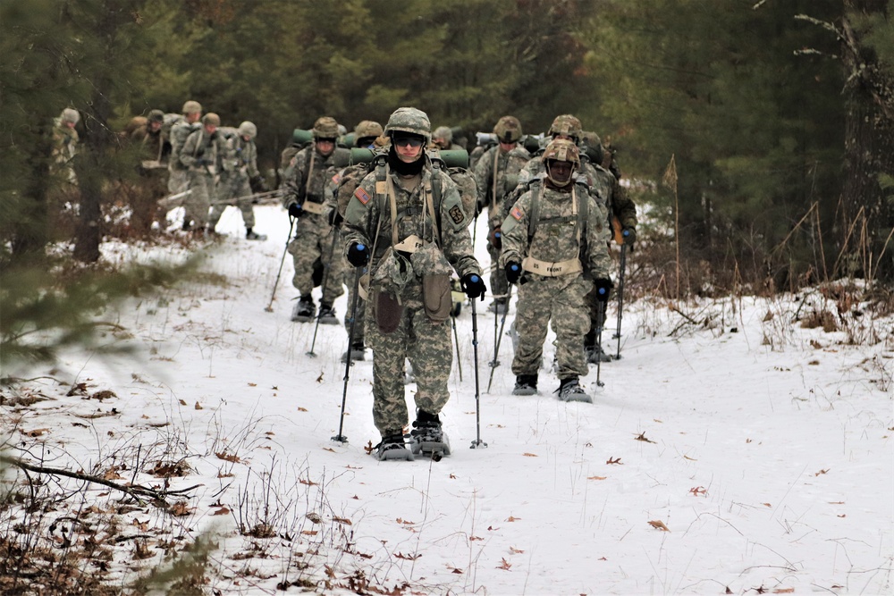 Fort McCoy Cold-Weather Operations Course students practice snowshoeing, ahkio sled use