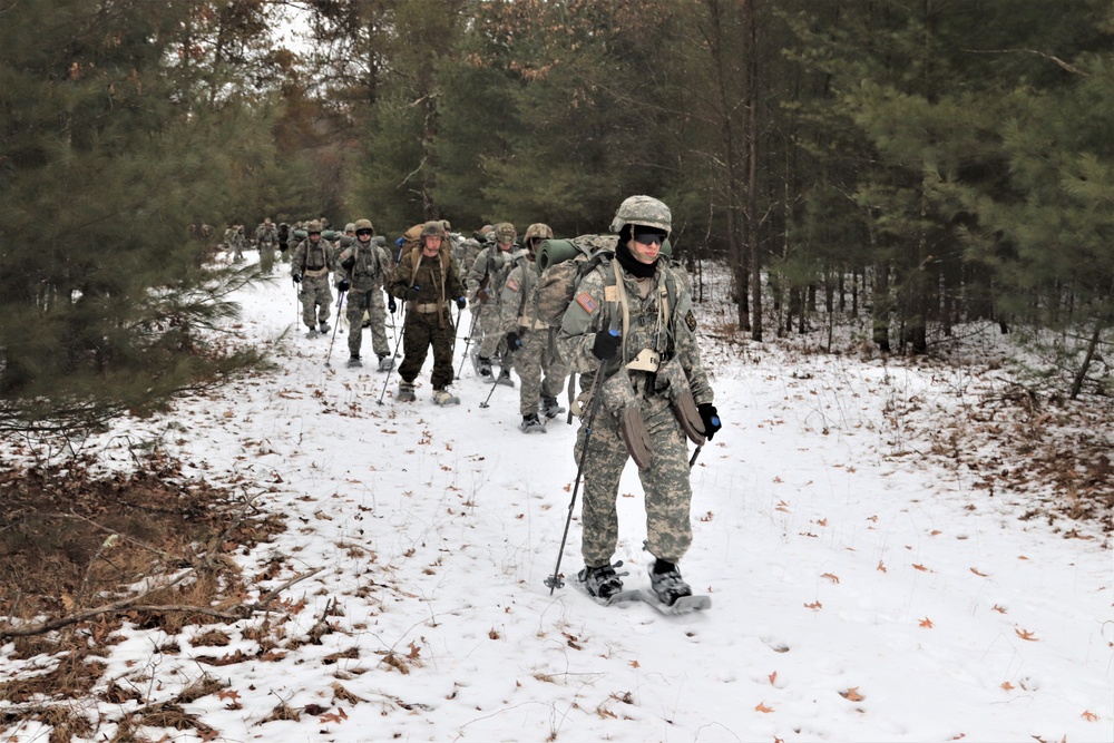 Fort McCoy Cold-Weather Operations Course students practice snowshoeing, ahkio sled use