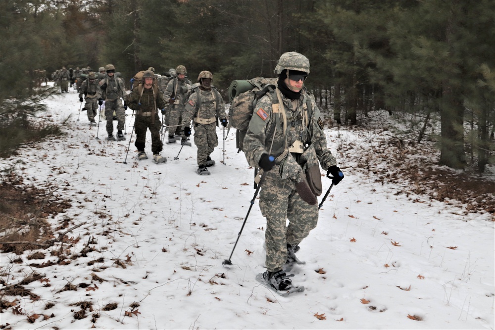 Fort McCoy Cold-Weather Operations Course students practice snowshoeing, ahkio sled use