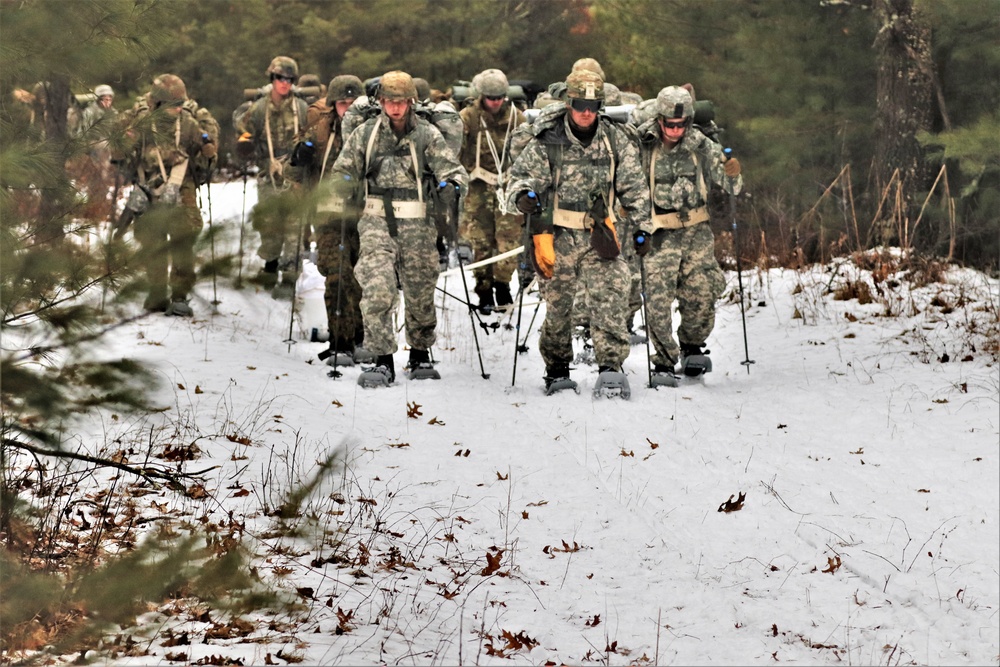 Fort McCoy Cold-Weather Operations Course students practice snowshoeing, ahkio sled use