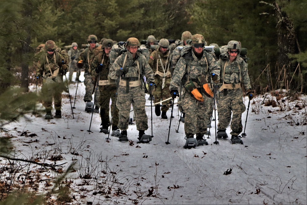Fort McCoy Cold-Weather Operations Course students practice snowshoeing, ahkio sled use