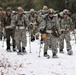 Fort McCoy Cold-Weather Operations Course students practice snowshoeing, ahkio sled use