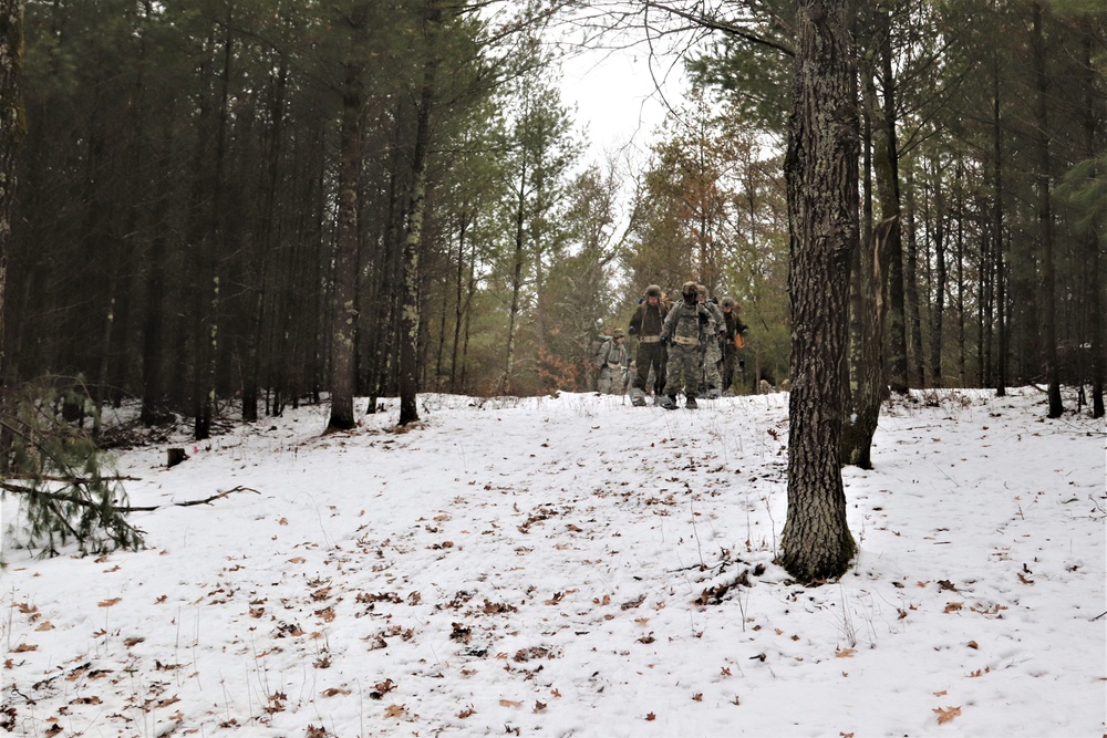 Fort McCoy Cold-Weather Operations Course students practice snowshoeing, ahkio sled use