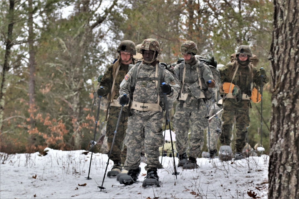 Fort McCoy Cold-Weather Operations Course students practice snowshoeing, ahkio sled use