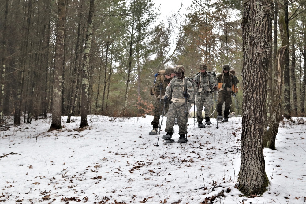 Fort McCoy Cold-Weather Operations Course students practice snowshoeing, ahkio sled use
