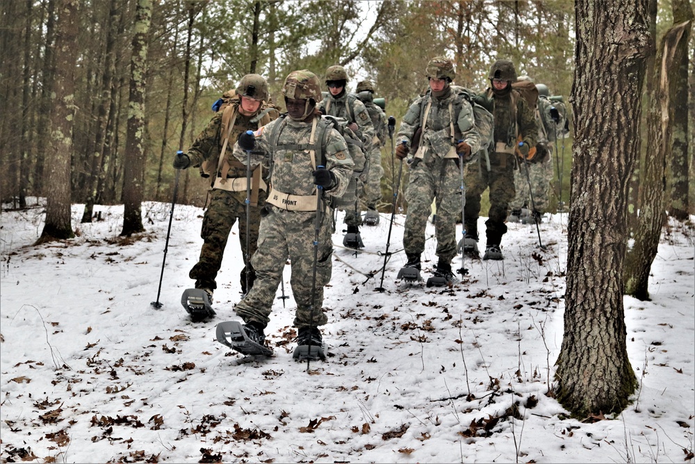 Fort McCoy Cold-Weather Operations Course students practice snowshoeing, ahkio sled use