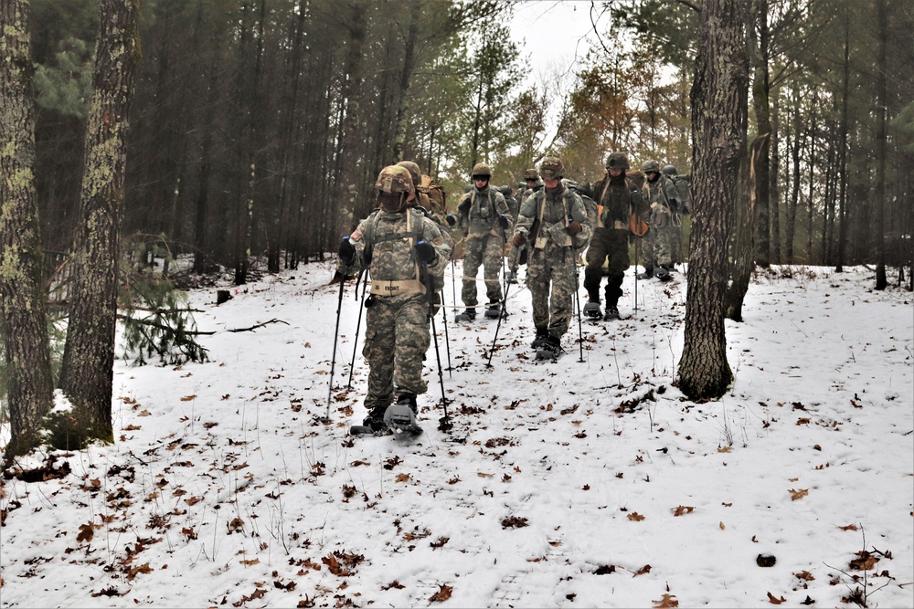 Fort McCoy Cold-Weather Operations Course students practice snowshoeing, ahkio sled use