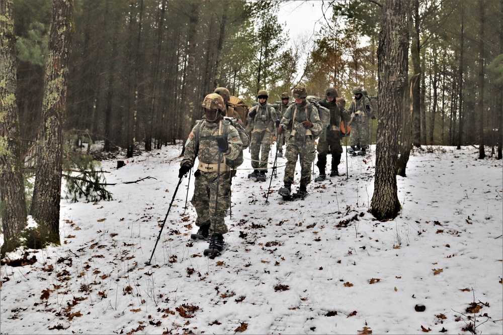 Fort McCoy Cold-Weather Operations Course students practice snowshoeing, ahkio sled use