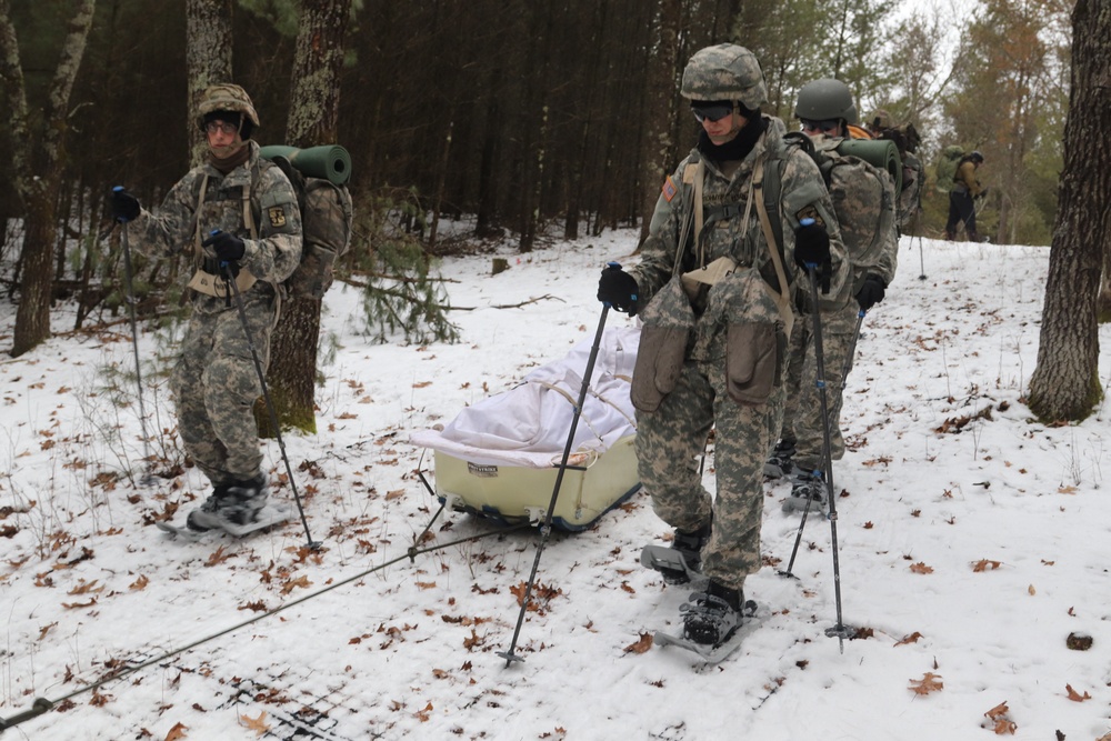 Fort McCoy Cold-Weather Operations Course students practice snowshoeing, ahkio sled use