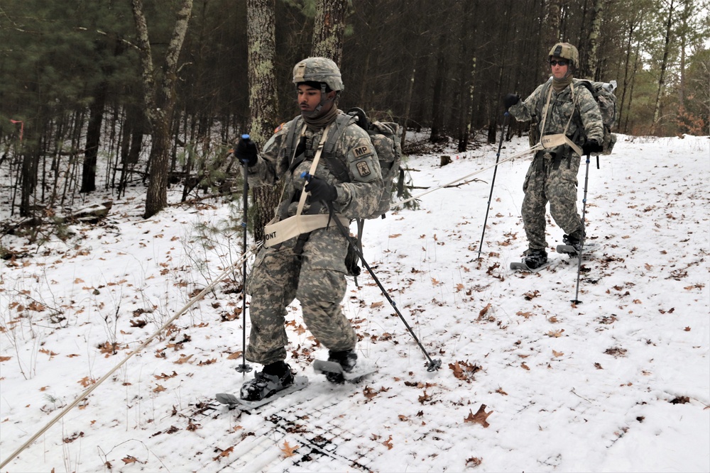 Fort McCoy Cold-Weather Operations Course students practice snowshoeing, ahkio sled use