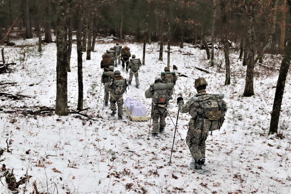 Fort McCoy Cold-Weather Operations Course students practice snowshoeing, ahkio sled use