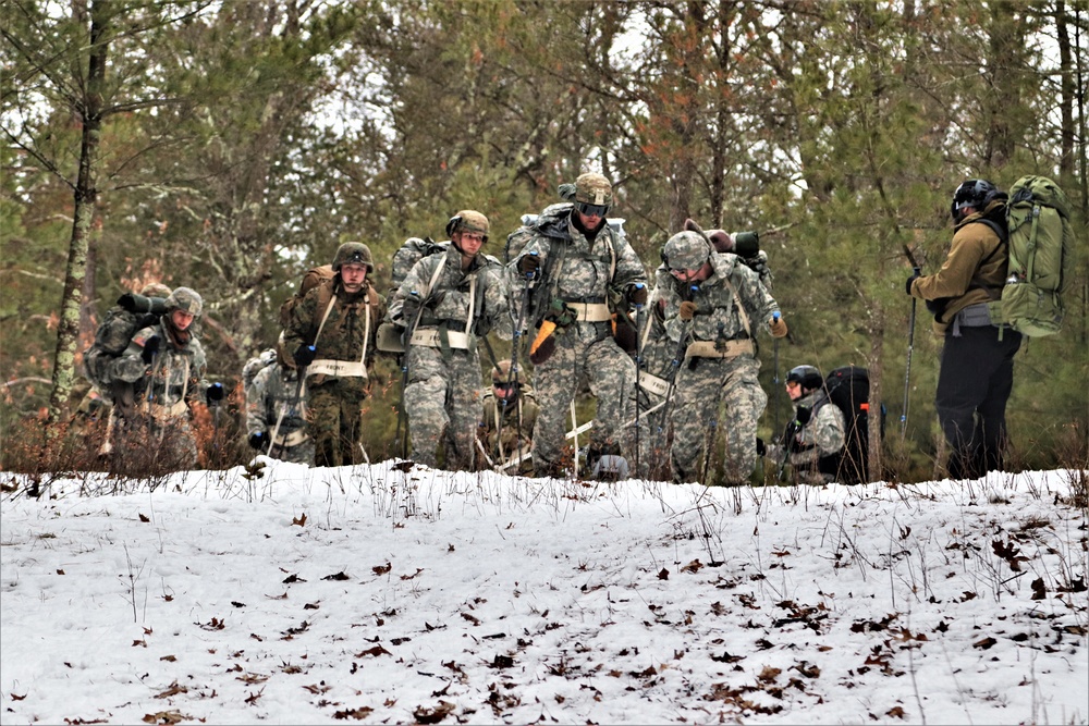 Fort McCoy Cold-Weather Operations Course students practice snowshoeing, ahkio sled use