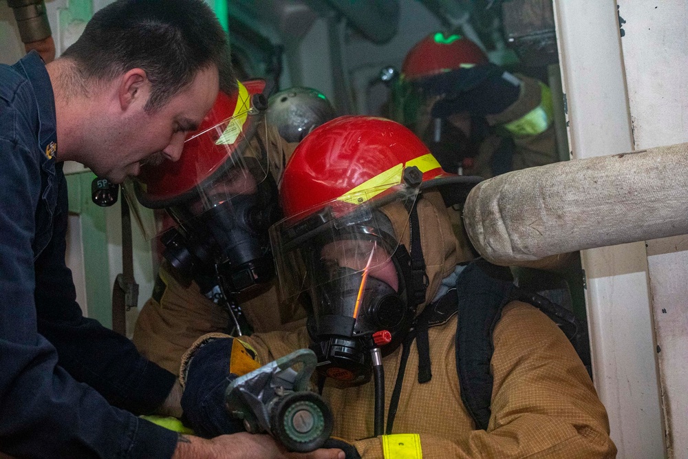 Sailors take part in a fire drill