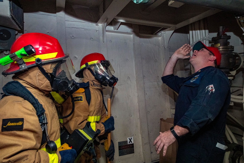 Sailors take part in a fire drill