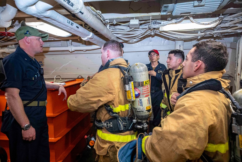 Sailors take part in a fire drill