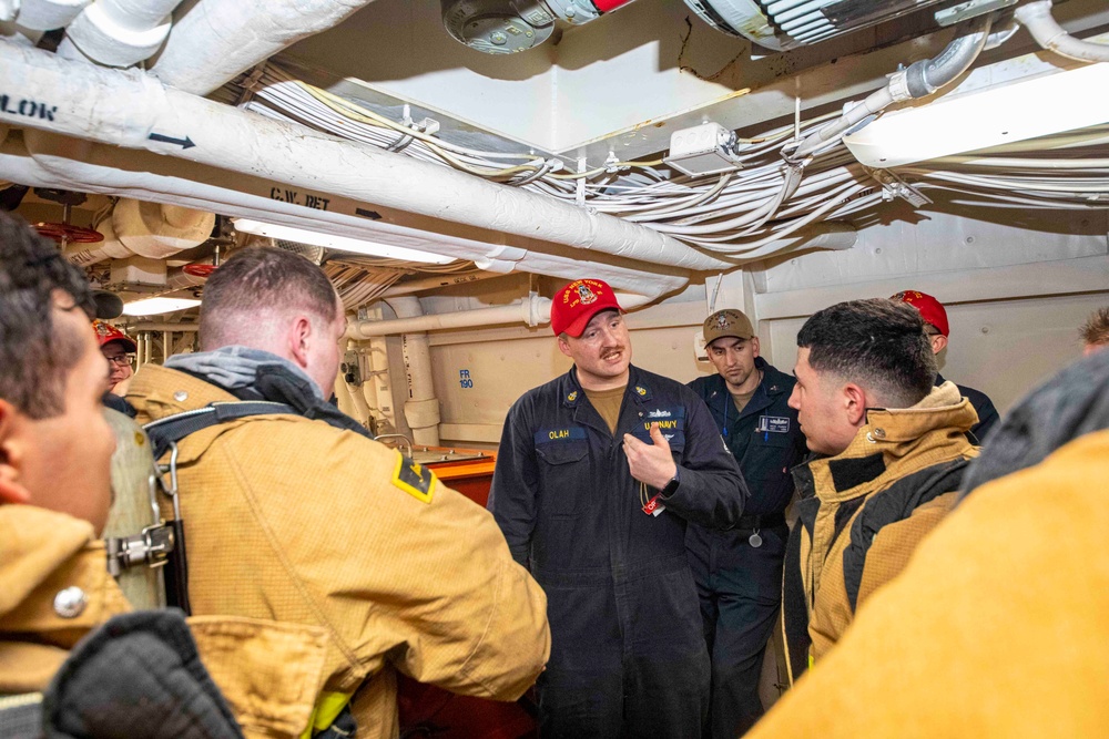 Sailors take part in a fire drill