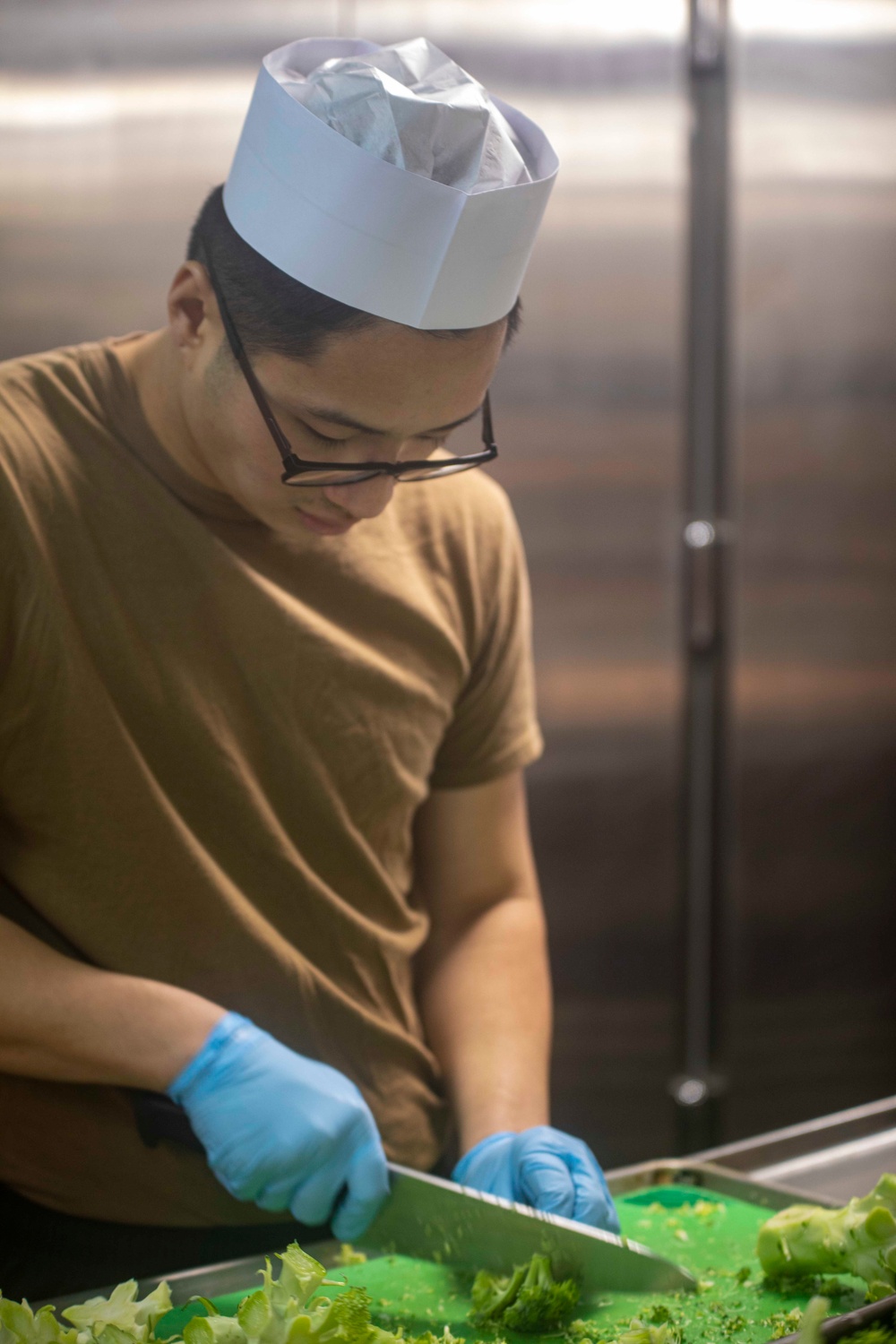 Sailor cuts broccoli