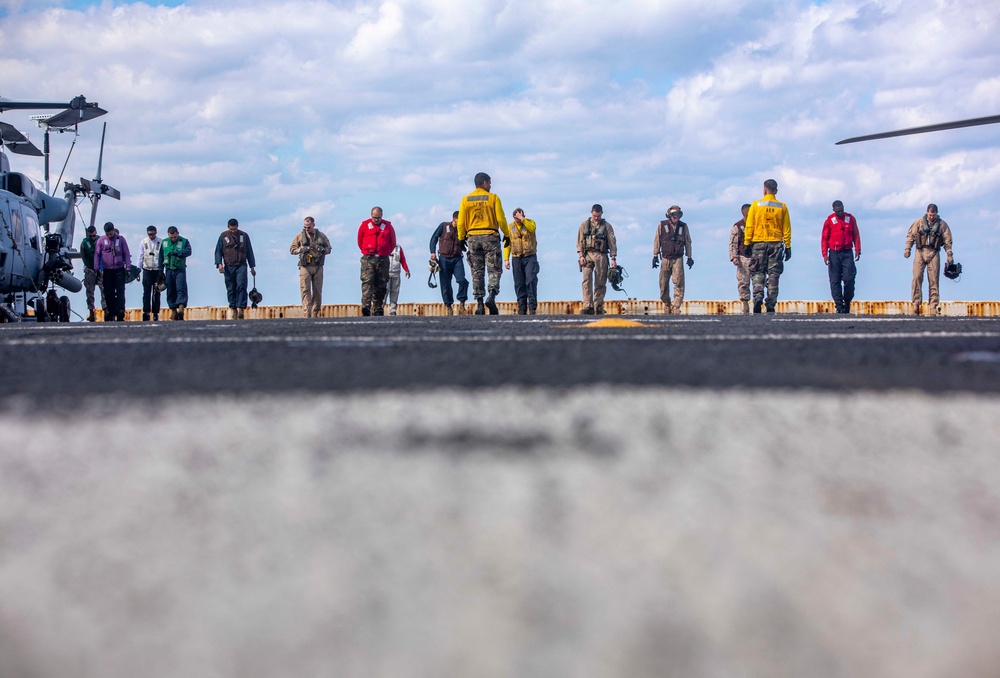 Sailors and Marines take part in flight operations