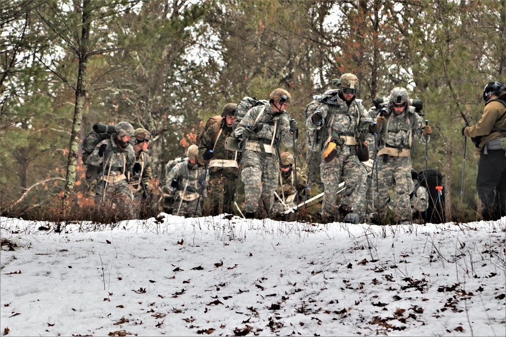 Fort McCoy Cold-Weather Operations Course students practice snowshoeing, ahkio sled use