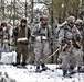 Fort McCoy Cold-Weather Operations Course students practice snowshoeing, ahkio sled use