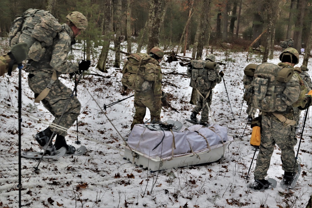 ort McCoy Cold-Weather Operations Course students practice snowshoeing, ahkio sled use