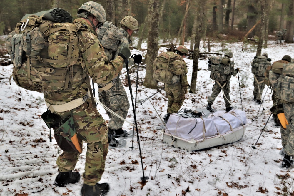 ort McCoy Cold-Weather Operations Course students practice snowshoeing, ahkio sled use