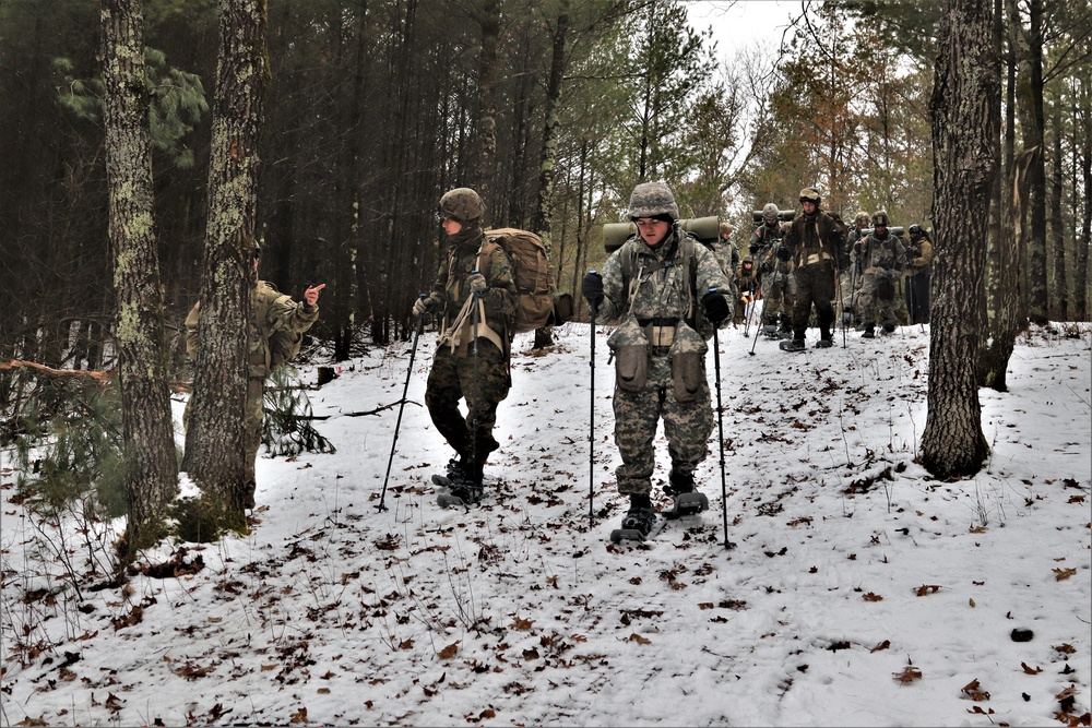 ort McCoy Cold-Weather Operations Course students practice snowshoeing, ahkio sled use