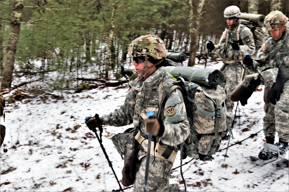 ort McCoy Cold-Weather Operations Course students practice snowshoeing, ahkio sled use