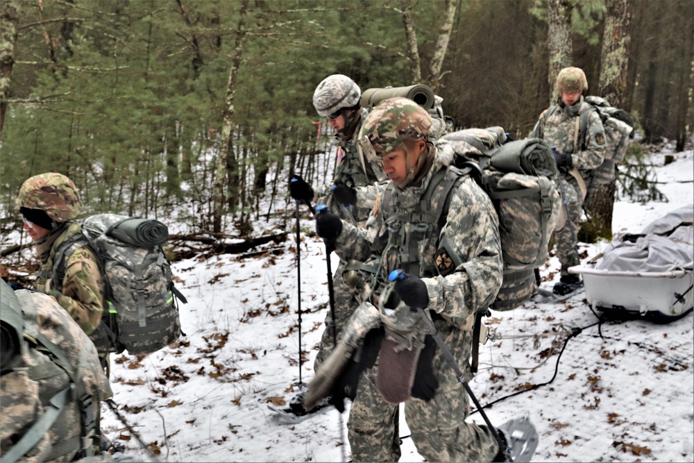 ort McCoy Cold-Weather Operations Course students practice snowshoeing, ahkio sled use