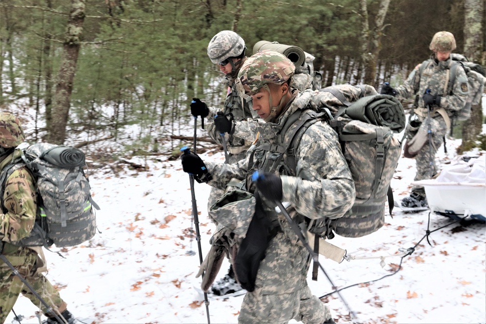 Fort McCoy Cold-Weather Operations Course students practice snowshoeing, ahkio sled use